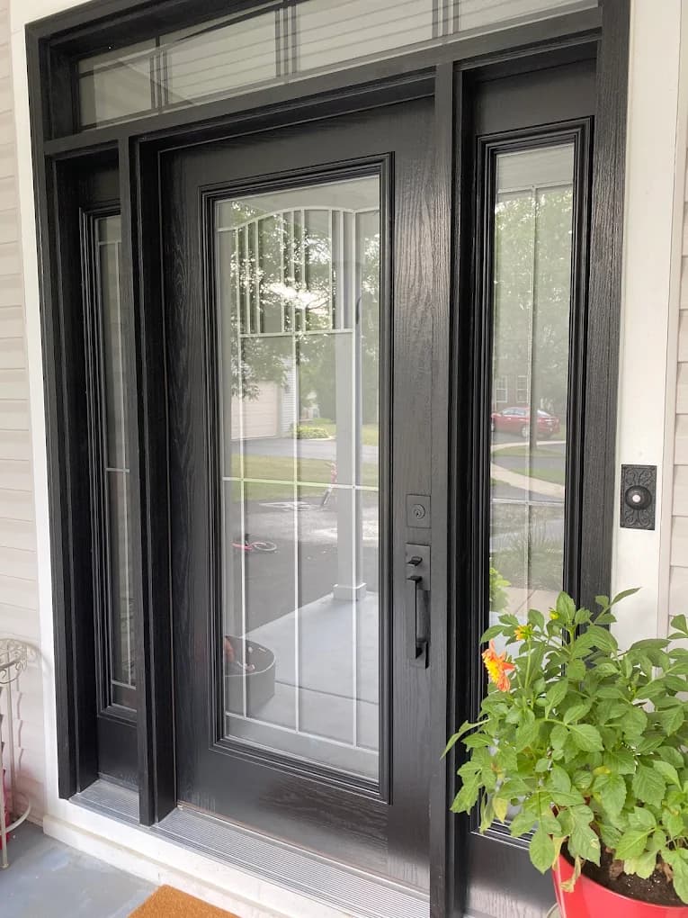 Black fiberglass entry door with leaded glass installed by Euro-Tech in the Midwest