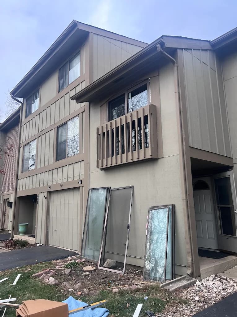 Old windows being removed during a replacement windows job in Rockford, IL